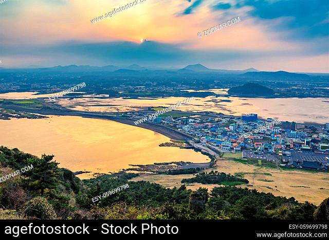 Jeju city skyline when sunset view from Seongsan Ilchulbong, Jeju Island, South Korea
