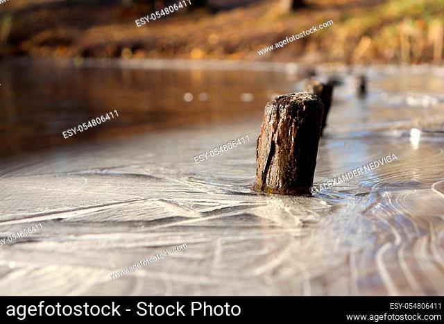 Lake Shoreline Ice Lines Pattern Surface Background Texture. Wavy Drawings of Ice Lines on a Frozen Lake with Stamp