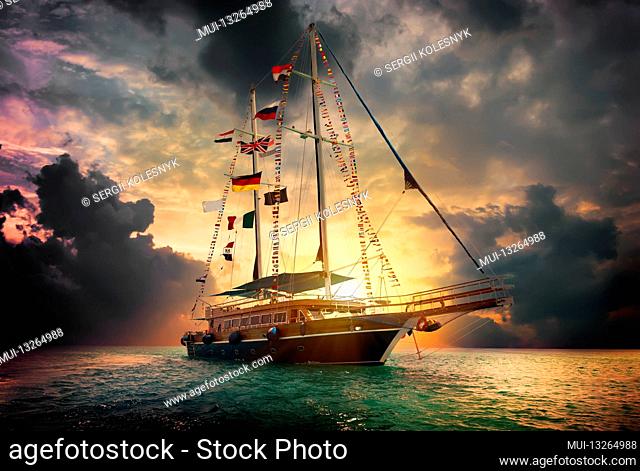 Sailboat in the sea and storm clouds