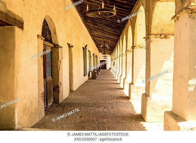 Shaded colonnade at the historic Mission San Miguel Arcangel in California
