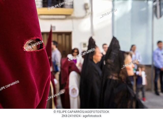 Detail of eye of penitence during a Holy week procession, Spain
