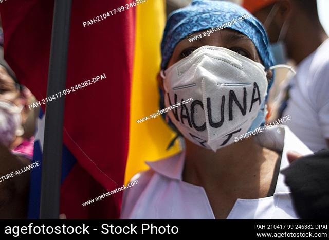 17 April 2021, Venezuela, Caracas: Hundreds of people march from Plaza los ""Palos Grandes"" to the headquarters of the United Nations Organization (UN) on Av...