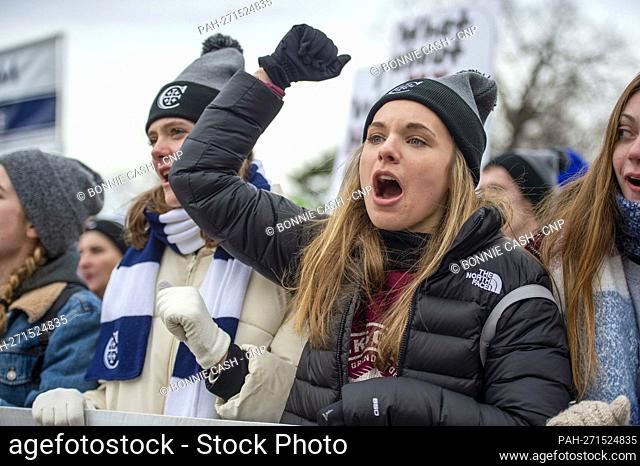 Participants in the 49th annual March for Life, a rally protesting the practice and legality of abortion, chant while standing in-between the US Capitol and the...