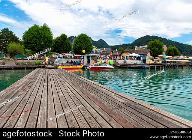 Sankt Gilgen, Austria - Juli 19, 2017: Wooden Jetty with speedboats for hire in Sankt Gilgen at Austrian Wolfgangsee
