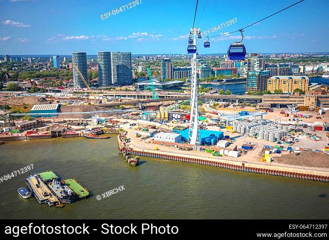 Thames river and developing of East London view from Greenwich Peninsula cable car, capital of United Kingdom