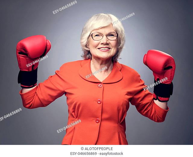 Senior lady in boxing gloves