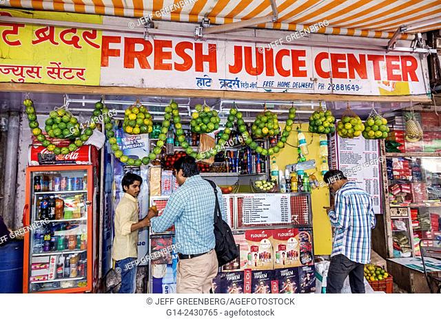 India, Asian, Mumbai, Apollo Bandar, Colaba, Causeway, Market, Shahid Bhagat Singh Marg, man, sale, display, Fresh Juice Center, convenience store, drinks