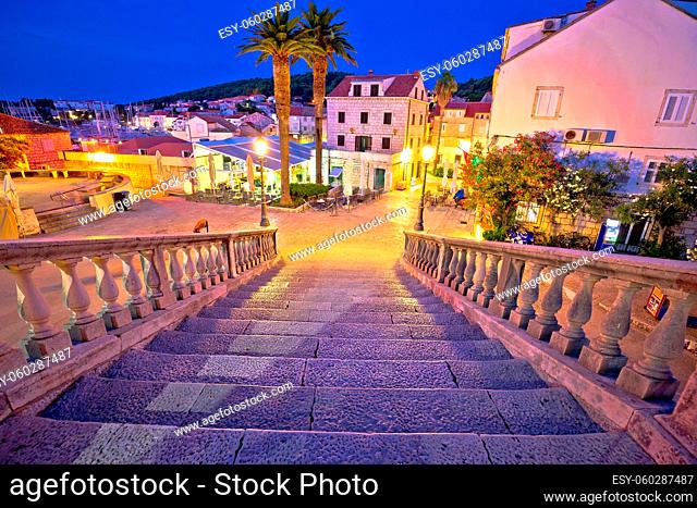 Korcula town gate stone steps and historic architecture evening view, historic tourist destination in archipelago of southern Dalmatia, Croatia