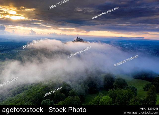 Hohenzollern Castle in the fog at sunset, Germany