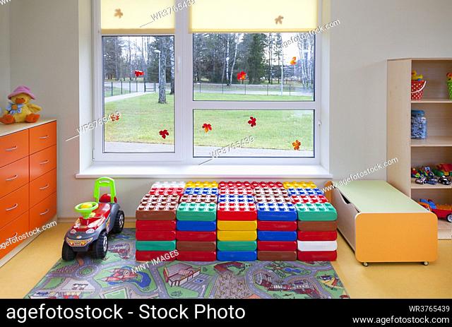 Day care nursery or pre-school kindergarten school, spacious interiors, play equipment