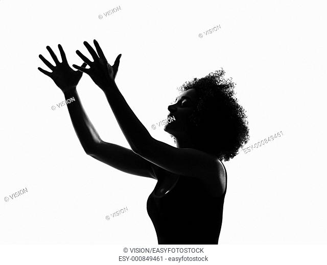 beautiful funny young afro american woman happy imploring in silhouette shadow on studio isolated white backgroung