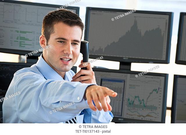 Trader at on phone