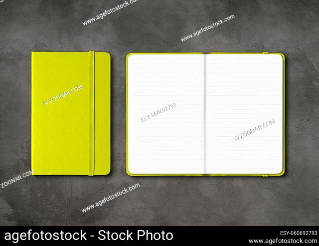 Lime green closed and open lined notebooks mockup isolated on dark concrete background