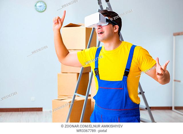 Painter contractor working with virtual reality goggles