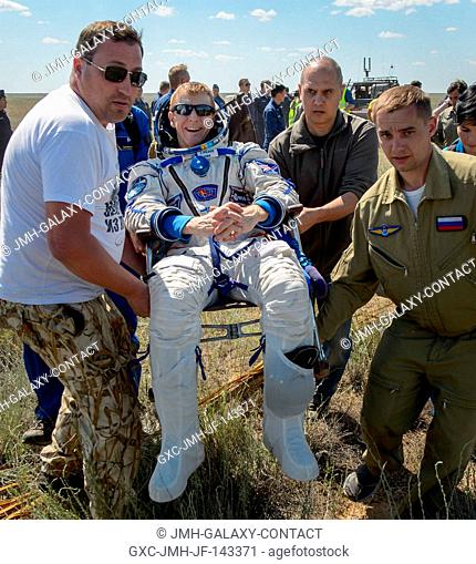 Tim Peake of the European Space Agency is carried to a medical tent after he and Tim Kopra of NASA and Yuri Malenchenko of Roscosmos landed in their Soyuz...