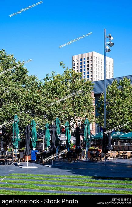Tilburg, North Brabant, The Netherlands, September 8, 2023 - Restaurant terraces and green decoration at the town hall square in summer