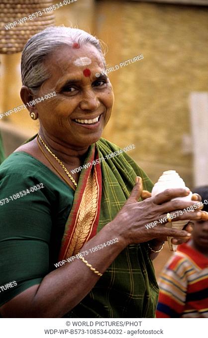 South India- Tamil Nadu Pongal Festival - Woman with Shell Horn Pongal festival falls in the month of January, a festival of Thanks giving to the Sun