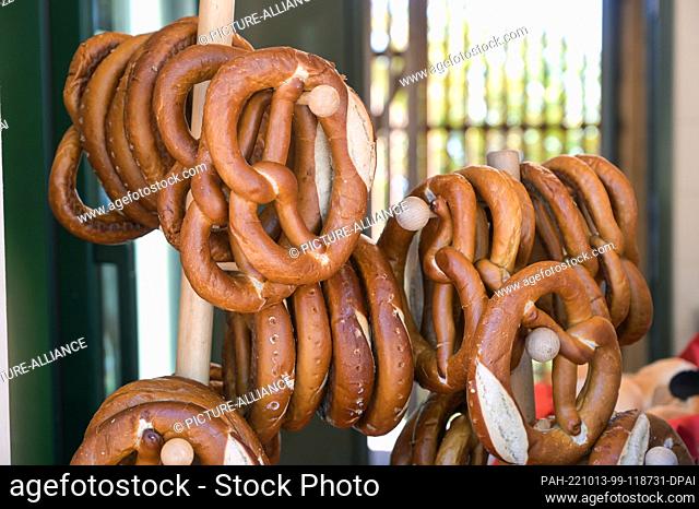 12 October 2022, Saxony-Anhalt, Halle (Saale): Fresh pretzels at a snack stand at the redesigned ""Reils-Alm"" facility at the Halle Mountain Zoo during the...