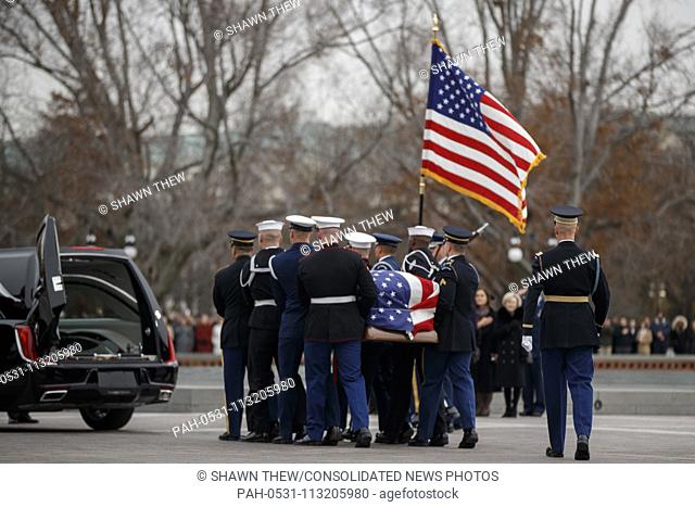 A joint service honor guard carries the casket of former US President George H.W. Bush out of the US Capitol in Washington, DC, USA, 05 December 2018
