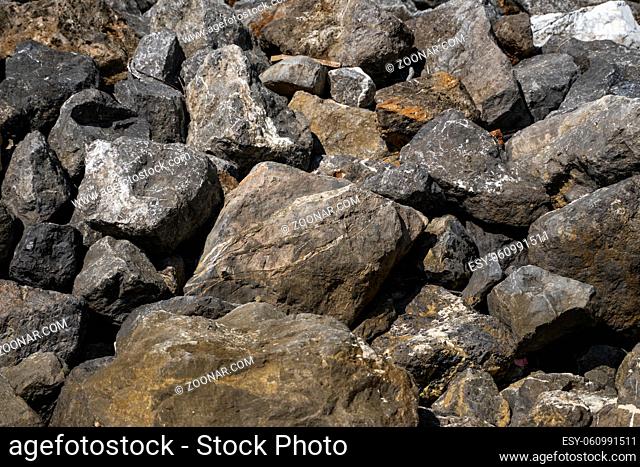 Big rocks on a beach in a sunlight