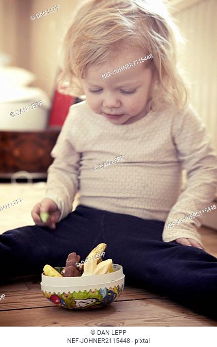 Toddler girl having a snack