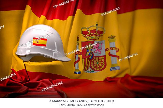 White hard hat laying over spanish flag. Construction and employment in Spain concept, 3d illustration