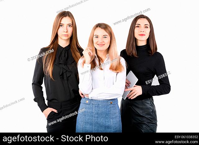 United Team Of Business Women. Portrait team of three smiling businesspeople isolated on white background. business women standing in a row