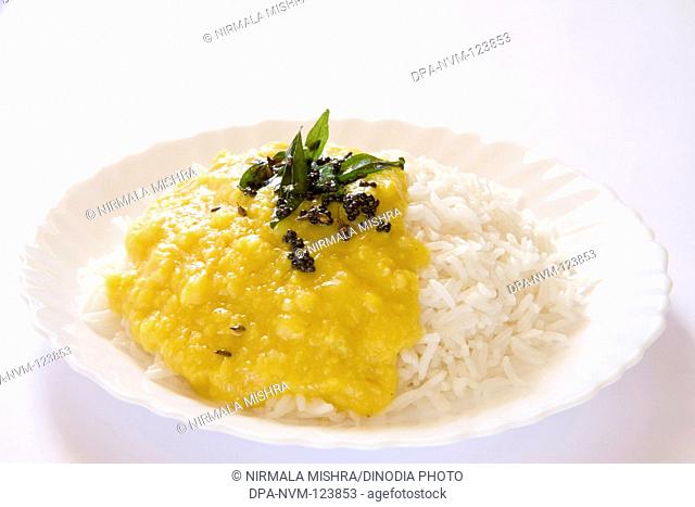 Indian cuisine boil basmati rice bhath chaval oryza sativa and fry or tadka moong dal mung beans phaseolus aureus , India