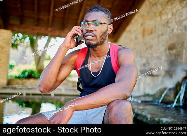 Young man on phone call outdoors