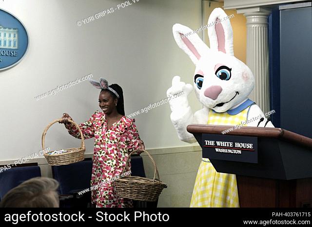Easter Bunny greets members of the media with candies before a press briefing in the James S. Brady Press Briefing Room of the White House in Washington