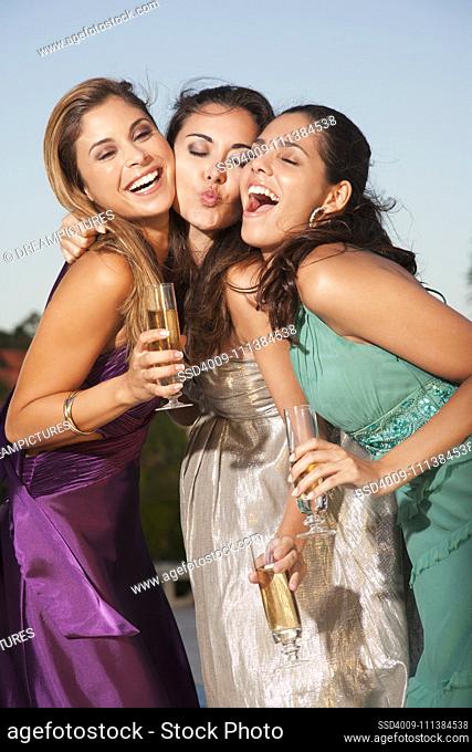 Women posing together at party