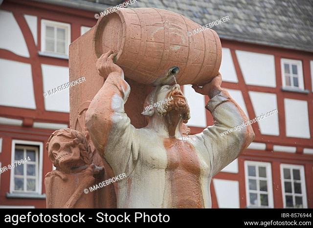 Drunkard fountain, Hattstein fountain with robber baron Friedrich von Hattstein and wine barrel, skull, drink, booze, lift, detail, roach, old town, Limburg
