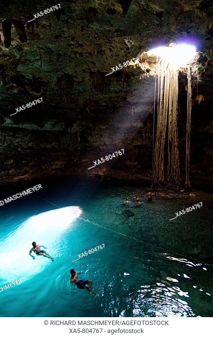 Mexico, Yucatan, Cenote Samula, near Valladolid, tourists enjoying a swim