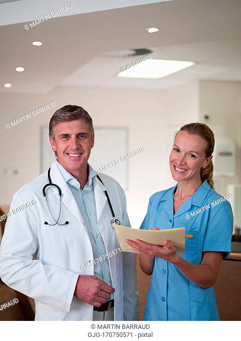 Doctor and nurse reviewing medical chart
