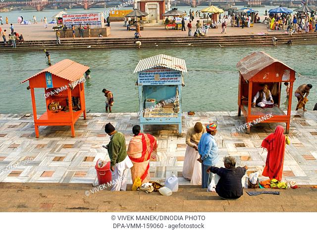 Pilgrims at bank of river Ganga ; Haridwar ; Uttaranchal Uttarakhand ; India