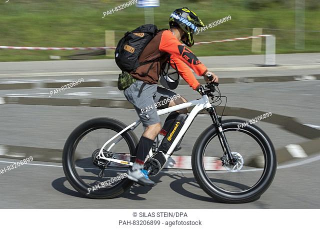 A visitor of the Eurobike fair tests an electronic mountain bike by Continental on the fair grounds in Friedrichshafen,  Germany, 31 August 2016