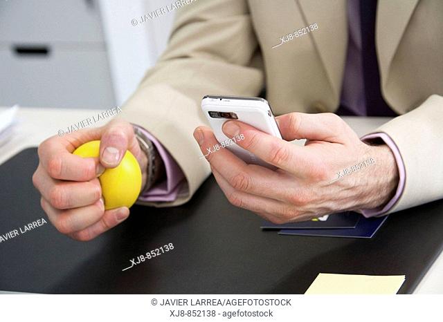 Using cell phone and stress ball
