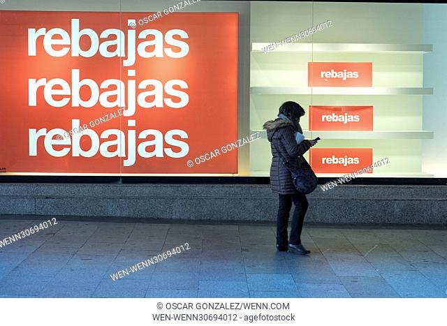A shop front sign announces discounts on the first day of the winter sales in Madrid on January 6, 2017. The period of winter sales in Spain is from January 7...