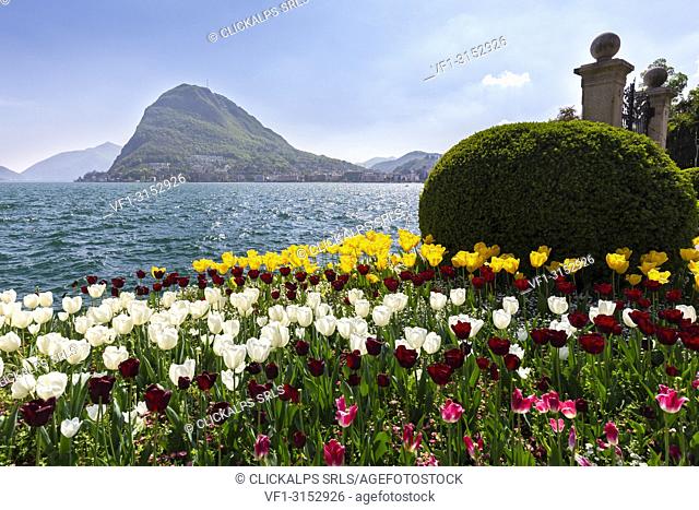 View of blooming flowerbed at Parco Ciani lakefront in Lugano city on a spring day, Canton Ticino, Switzerland