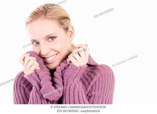 Beautiful young woman in soft sweater, isolated on white