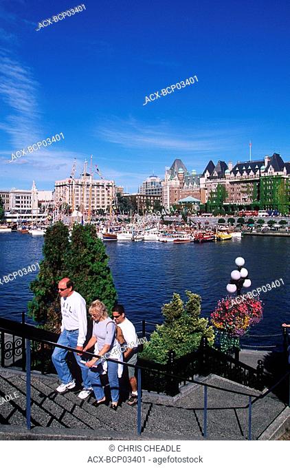 Tourists walking around the Inner Harbour, Victoria, Vancouver Island, British Columbia, Canada