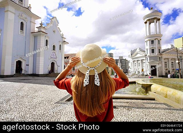 Tourism in Curitiba, Brazil. Back view of young tourist woman in the historic center of Curitiba, Parana, Brazil