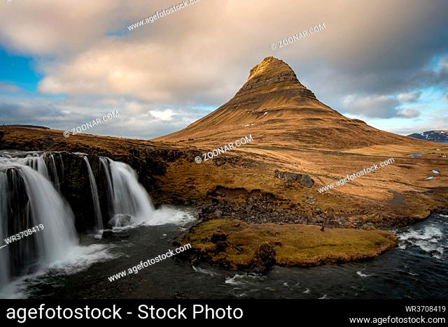 The Kirkjufell mountain and the kirkjufellfoss waterfall at grundarfjordur at Snaefellsnes peninsula in Iceland