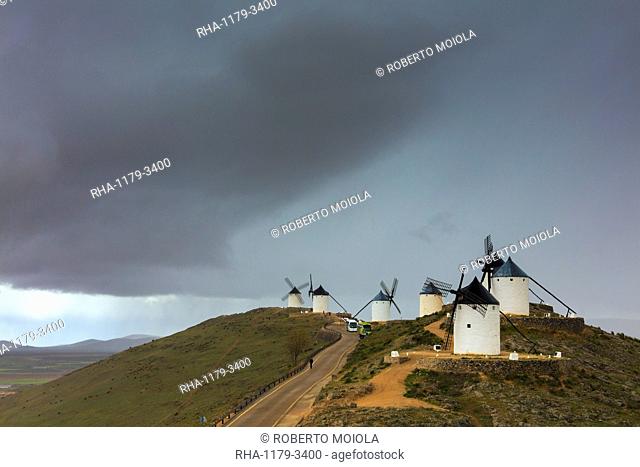 Storm clouds on windmills of Consuegra, Don Quixote route, Toledo province, Castilla-La Mancha (New Castile) region, Spain, Europe