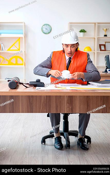 The young male architect working in the office