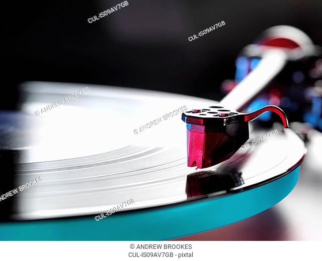 Close up of a vinyl record and stylus on turntable