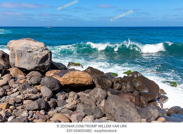 Rocky coast of Madeira Island with breaking waves