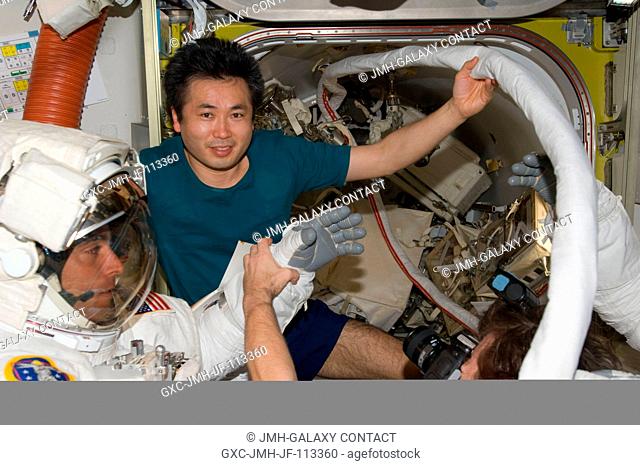 Attired in his Extravehicular Mobility Unit (EMU) spacesuit, astronaut Christopher Cassidy, STS-127 mission specialist, is pictured in the Quest Airlock of the...