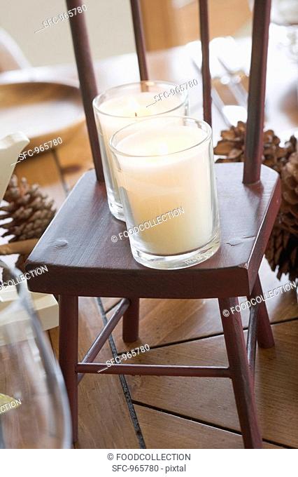 Christmas table decoration: candles on small chair