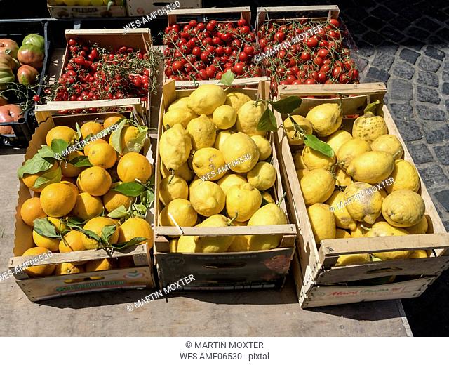 Italy, Ischia, Crates with fresh lemons and tomatoes on Piazza Marina